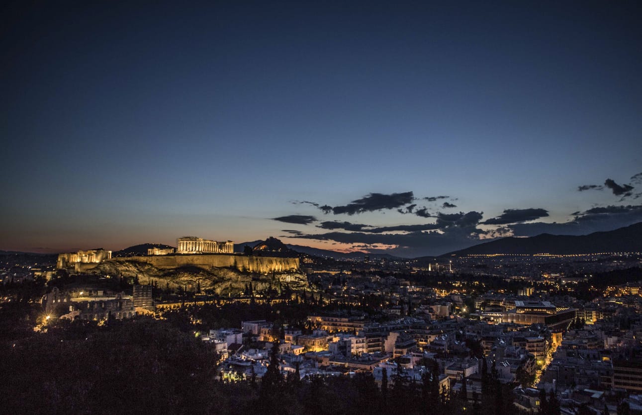 Illuminated Acropolis above Athens at night – Hairakles hair transplant concierge in Greece